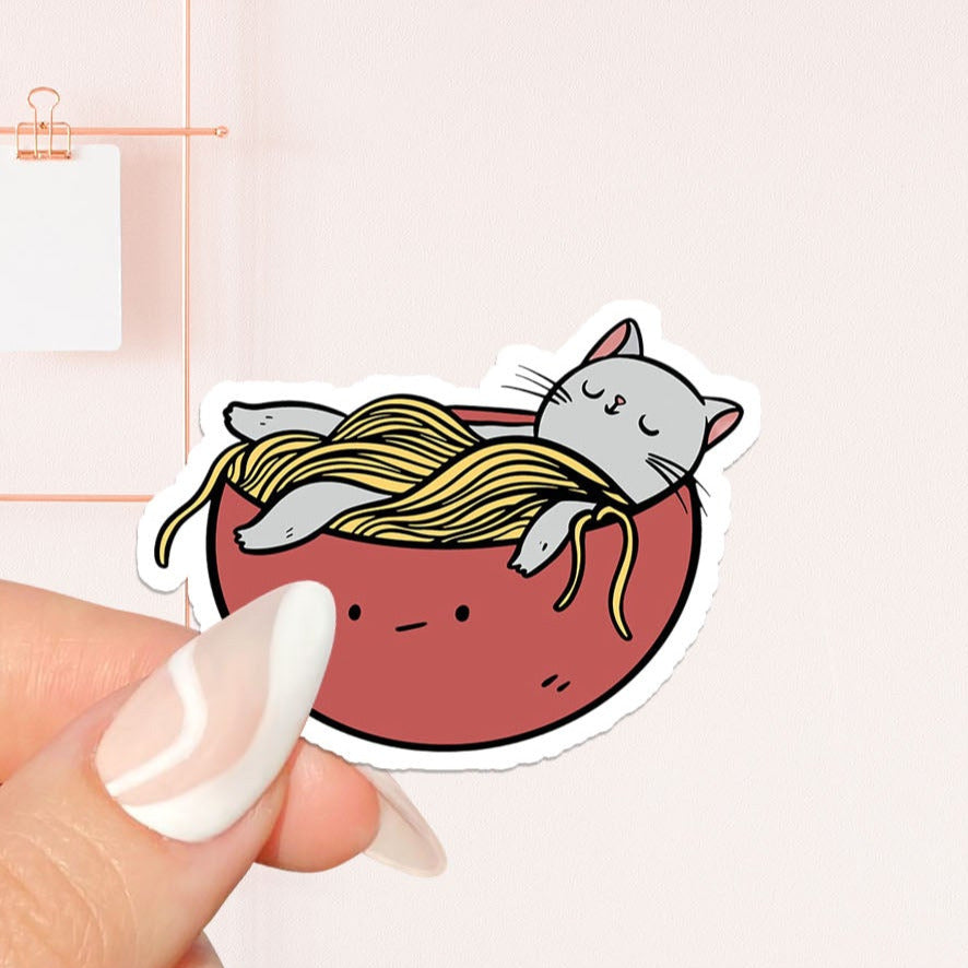 Cat sleeping in bowl of noodles Sticker